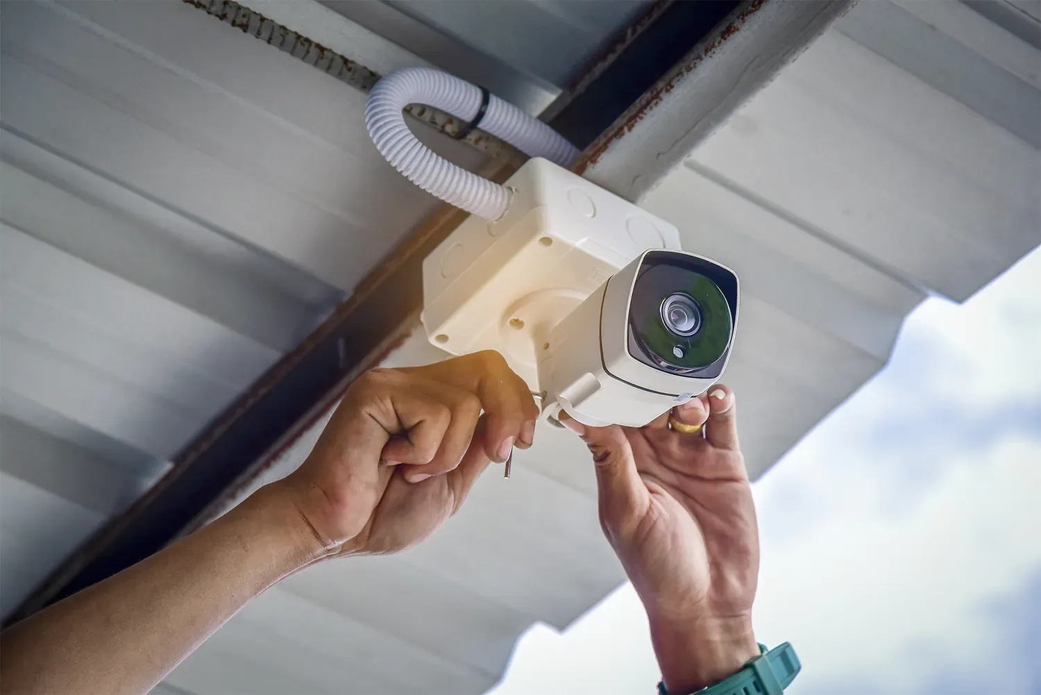Person-installing-security-camera
